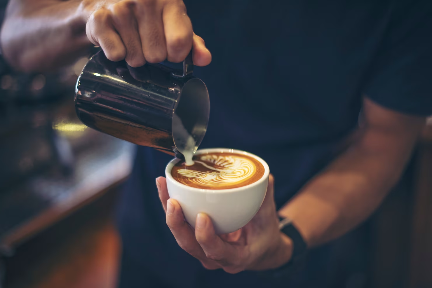 Barista makes coffee